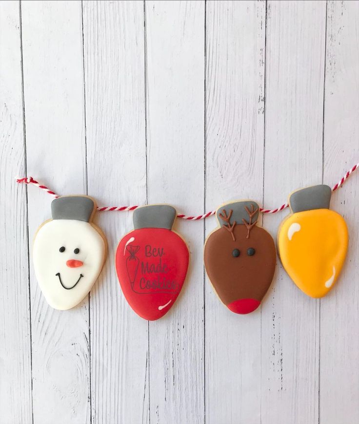 Whimsical Festive Cookies: Snowman, Reindeer, Ornament & Bulb Designs Perfect for Holiday Celebrations.