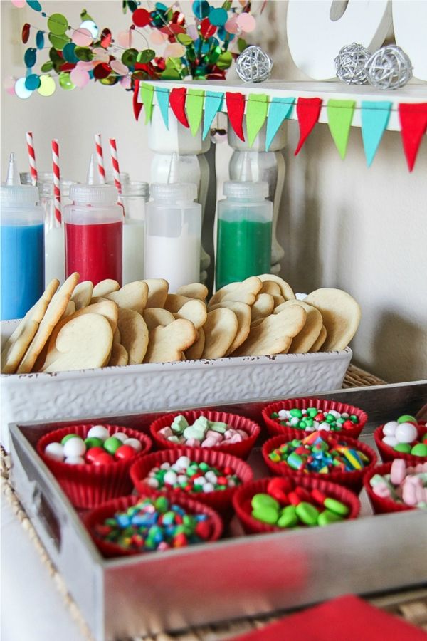 Vibrant Dessert Display: Colorful Cookies and Festive Cupcake Liners Enhancing a Cheerful Atmosphere.