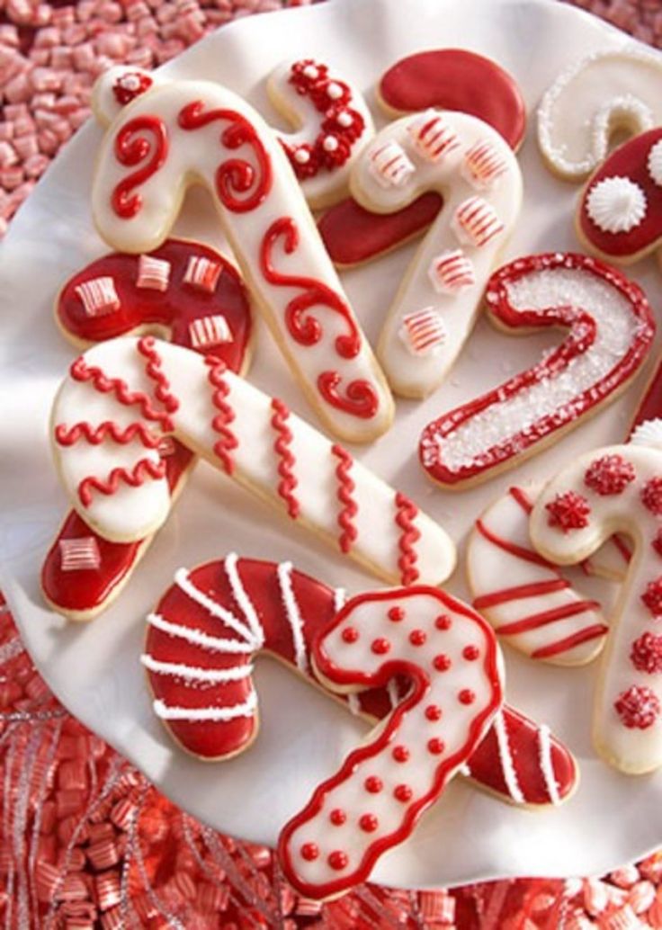 Charming Festive Candy Cane Cookies with Whimsical Designs and Cheerful Holiday Spirit.