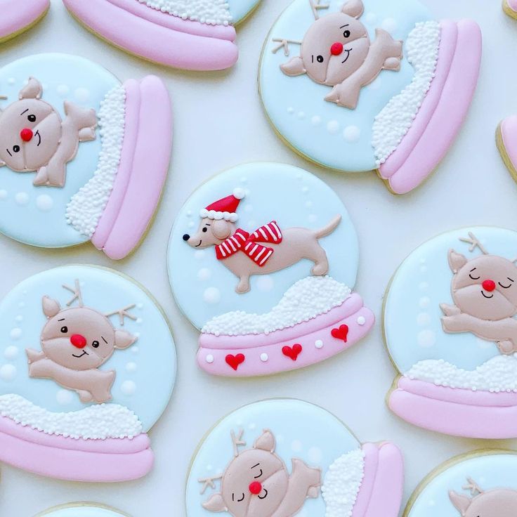 Whimsical Holiday Cookies Featuring Adorable Reindeer and Dog Designs in Snow Globes