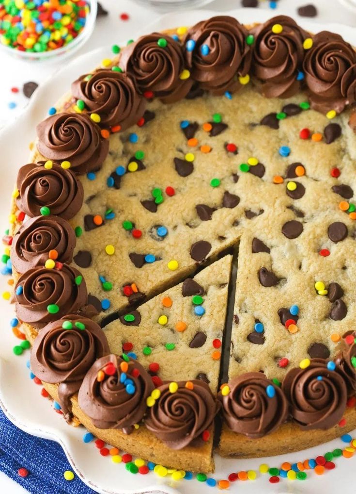 Festive Chocolate Chip Cookie Cake with Piped Rosettes and Colorful Sprinkles