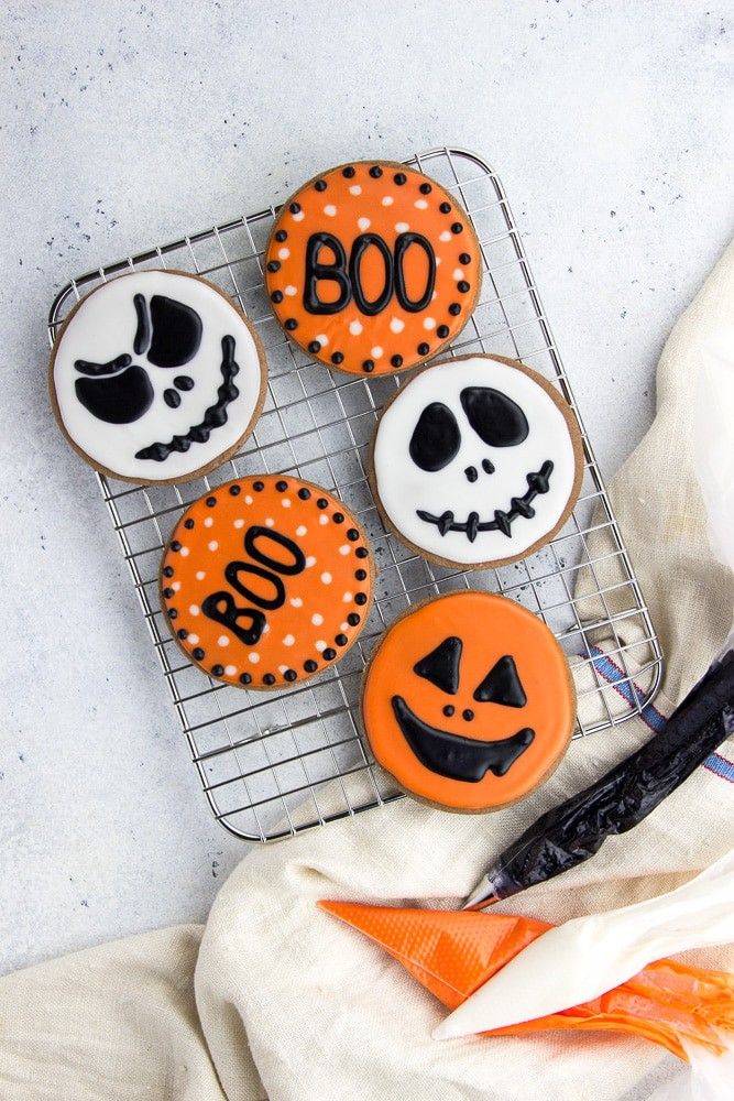 Playful Halloween Cookies: Spooky Designs in Vibrant Orange and Black