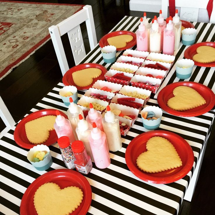 Festive Colorful Dessert Table with Heart-Shaped Cookies and Creative Touches