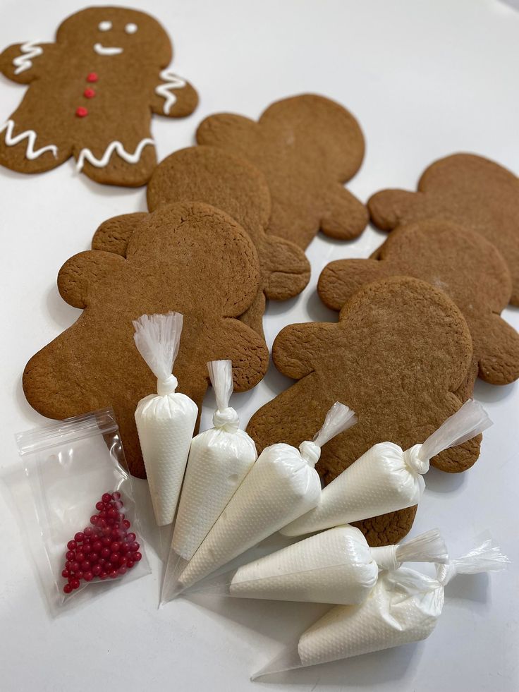 Gingerbread Cookie Decoration Set with Icing and Festive Red Beads for Creative Embellishment.