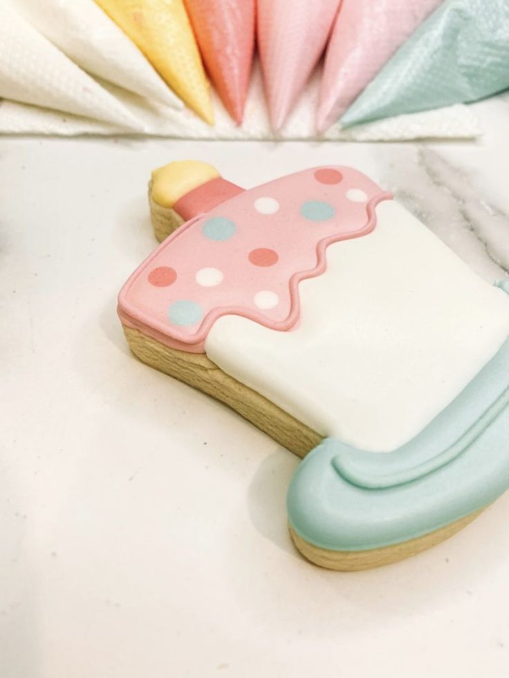 Whimsical Winter Stocking Cookie Design: A Playful Inspiration for Festive Nail Art in Soft Pastels.