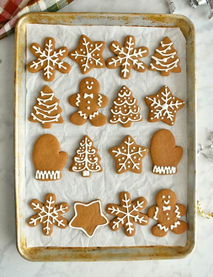 Festive Gingerbread Cookie Assortment with Intricate Icing Designs.