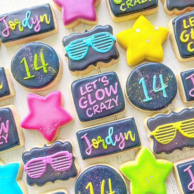 Vibrant Geometric Cookies with Festive Star and Sunglasses Designs.