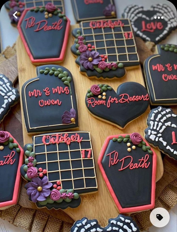 Gothic-Themed Decorative Cookies: Intricate Black Icing with Floral Accents and Spooky Elegance.