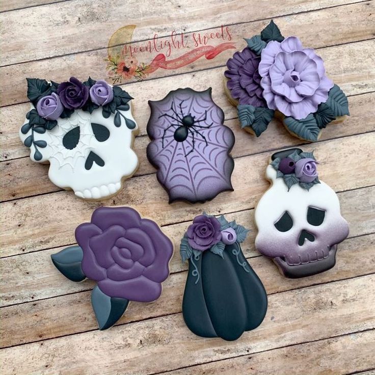 Gothic Cookie Designs: Intricate Floral and Whimsical Skull Motifs in a Deep Purple Halloween Palette.