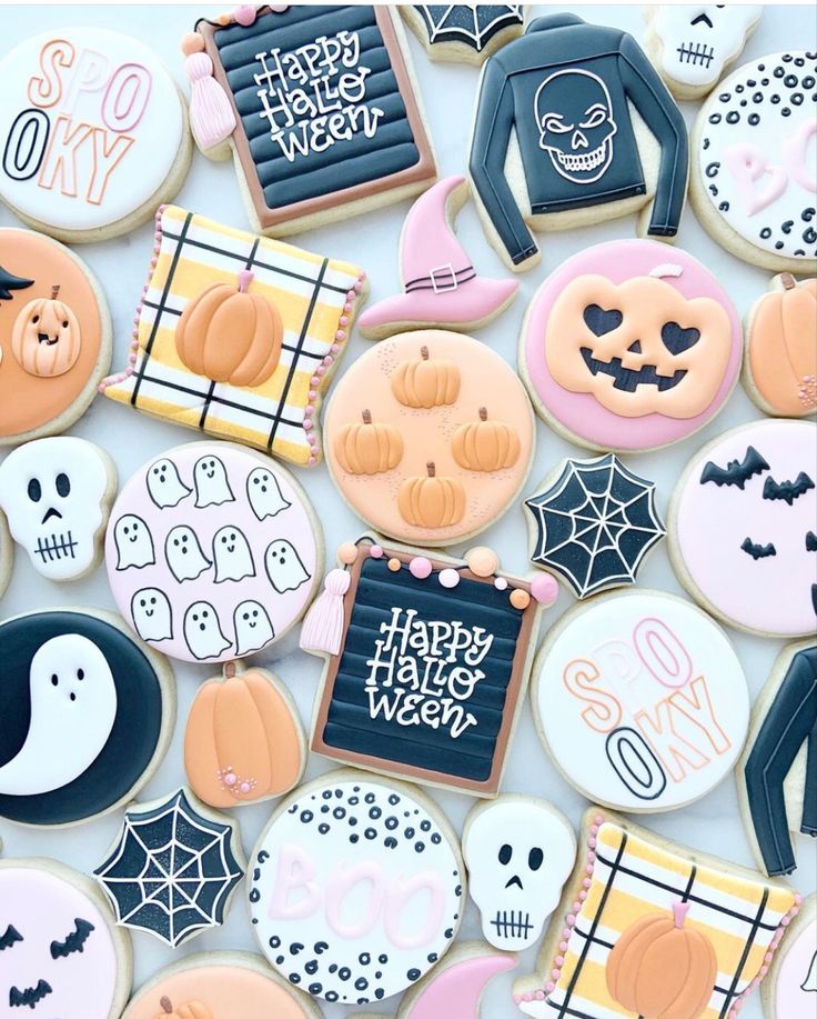 Whimsical Halloween Cookie Designs: Playful Motifs of Ghosts, Pumpkins, and Skulls in Festive Colors.