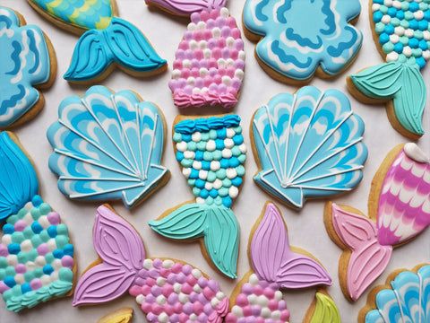 Whimsical Mermaid-Themed Cookie Designs Inspire Creative Oceanic Nail Art.