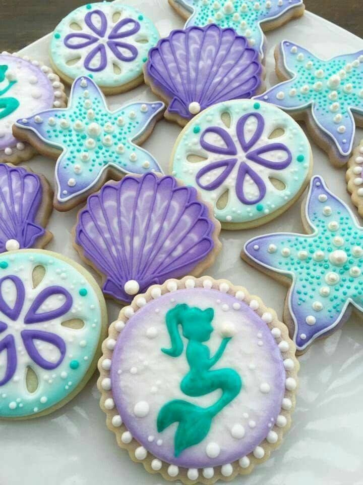 Enchanting Mermaid-Inspired Cookies Decorated with Oceanic Delights in Pastel Hues.