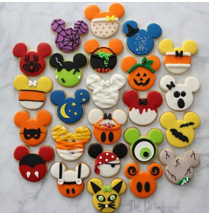 Festive Iconic Mouse-Shaped Cookies Showcase Whimsical Designs and Vibrant Colors.