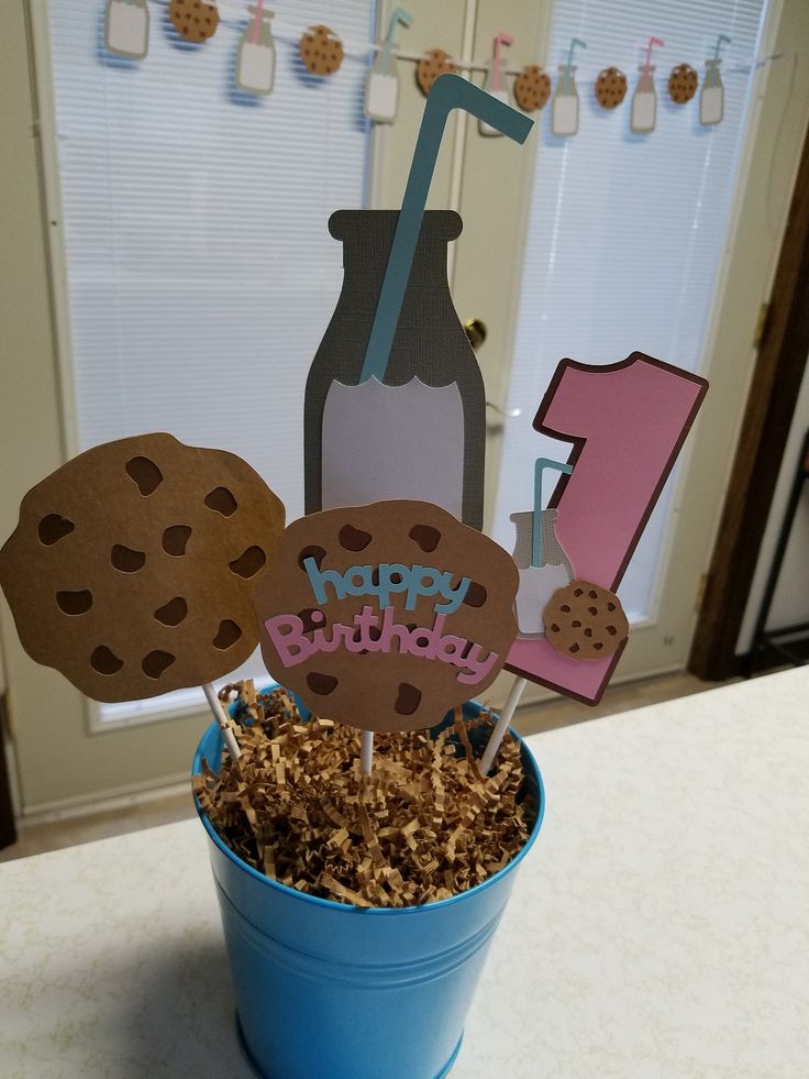 Whimsical Birthday Centerpiece with Cheerful Decorations in a Blue Pot.