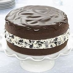 Indulgent Chocolate Layer Cake with Creamy Filling and Glossy Ganache Topping