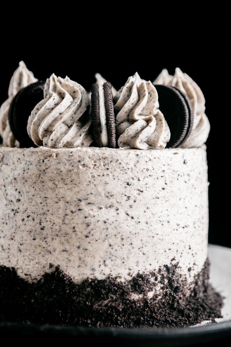 Indulgent Layered Cake with Cookies and Cream Frosting and Whipped Topping.