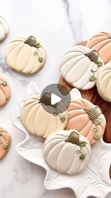 Intricately Designed Pumpkin-Shaped Cookies: A Seasonal Delight in Soft Pastels