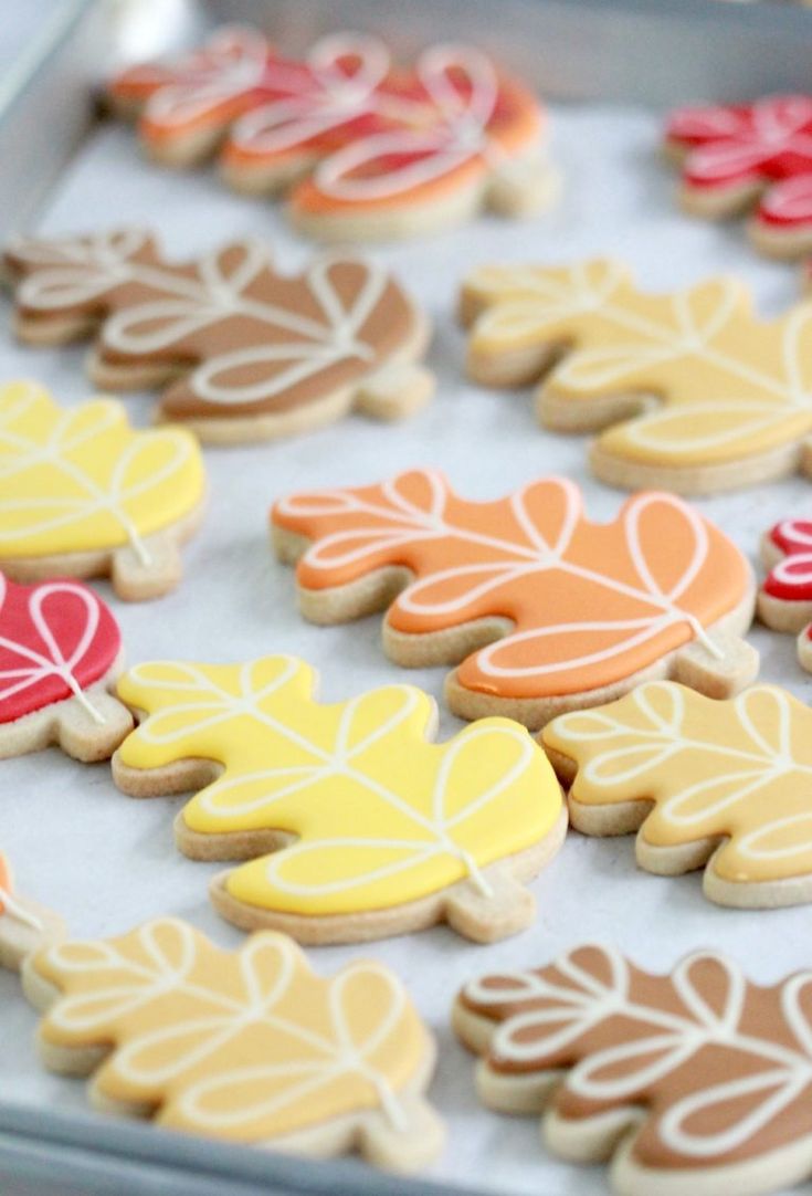 Autumn-Inspired Colorful Leaf-Shaped Cookies Adorned with Intricate Icing.