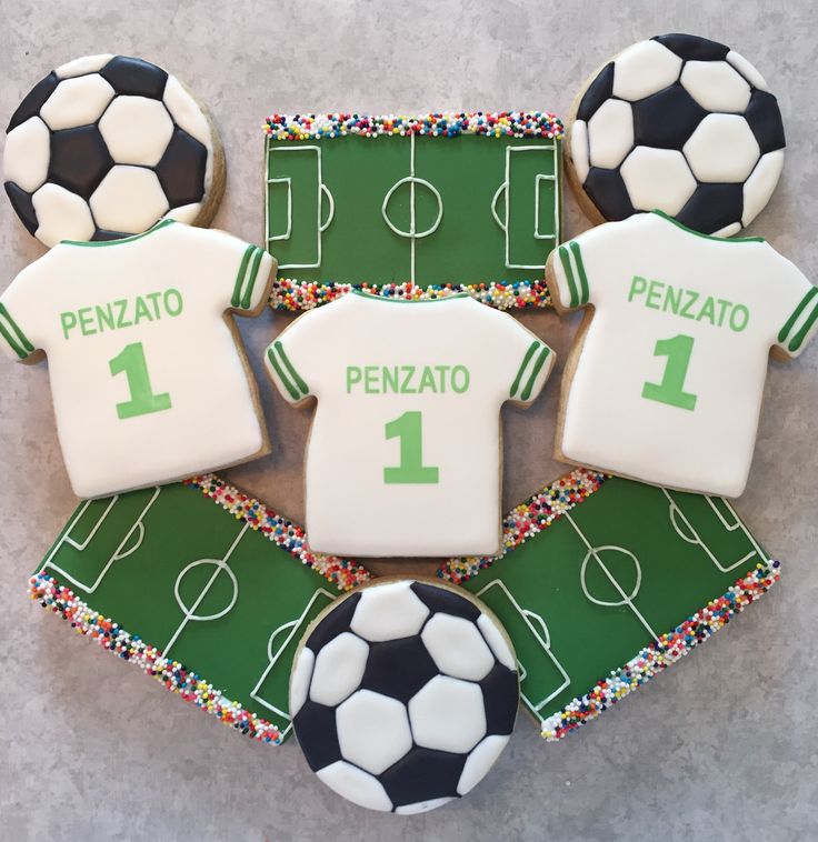 Soccer-Themed Cookies: Festive Designs with Black and White Balls, Custom Jerseys, and Green Icing for Celebrations.