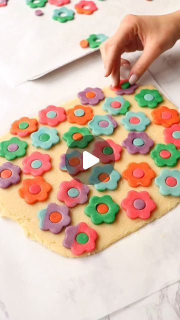 Whimsical Flower-shaped Cookie Cutouts Brighten Up Desserts with Cheerful Colors.