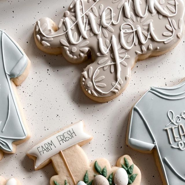 Charming Decorative Cookies with Intricate Icing and Soft Pastel Aesthetics.