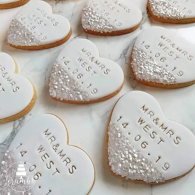 Enchanting Heart-Shaped Cookies: Elegantly Iced and Inscribed for Celebrations.