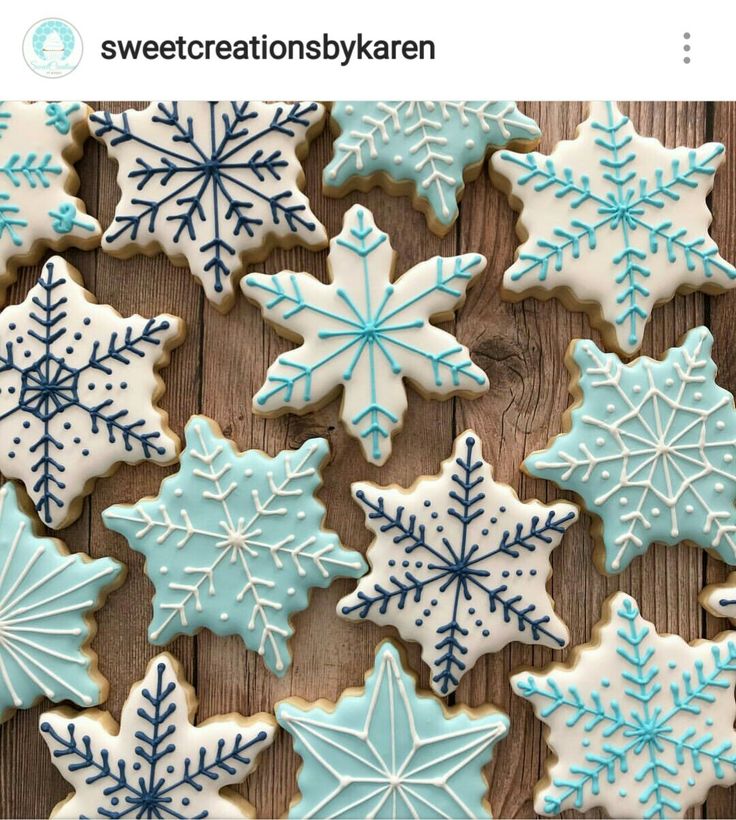 Intricate Snowflake Sugar Cookies in Elegant Blue and White Designs for Seasonal Celebrations.