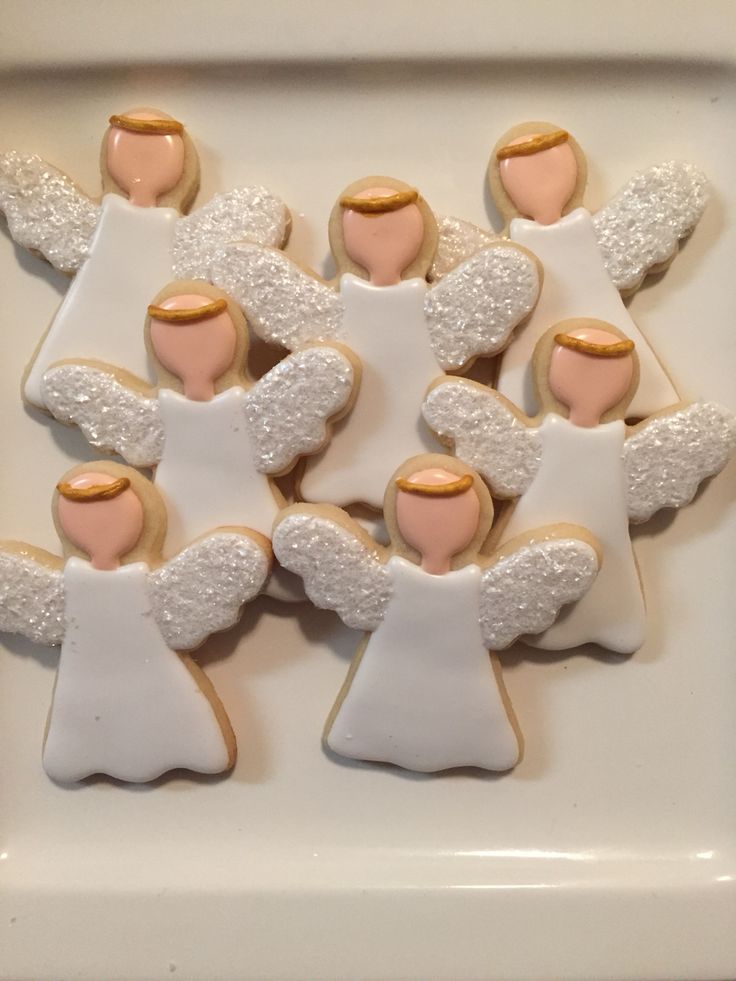 Whimsical Angel-Themed Cookies: Charming, Pastel-Frosted Delights for Celebrations.