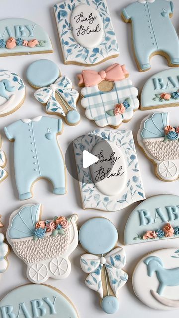 Charming Baby-Themed Cookies: A Delightful Display of Colorful Designs and Textures.