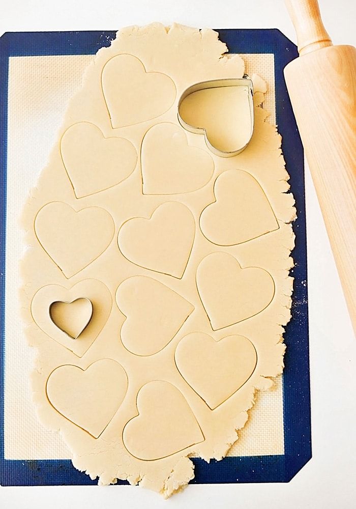 Whimsical Heart-Shaped Dough Cutouts and Baking Essentials Invitation.