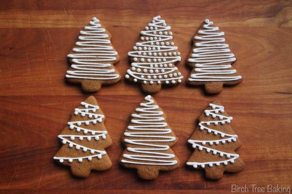 Festive Gingerbread Christmas Trees Adorned with Intricate Icing Designs.