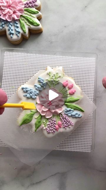 Whimsical Floral Cookie Design with Intricate Icing Techniques in Soft Pastel Shades.