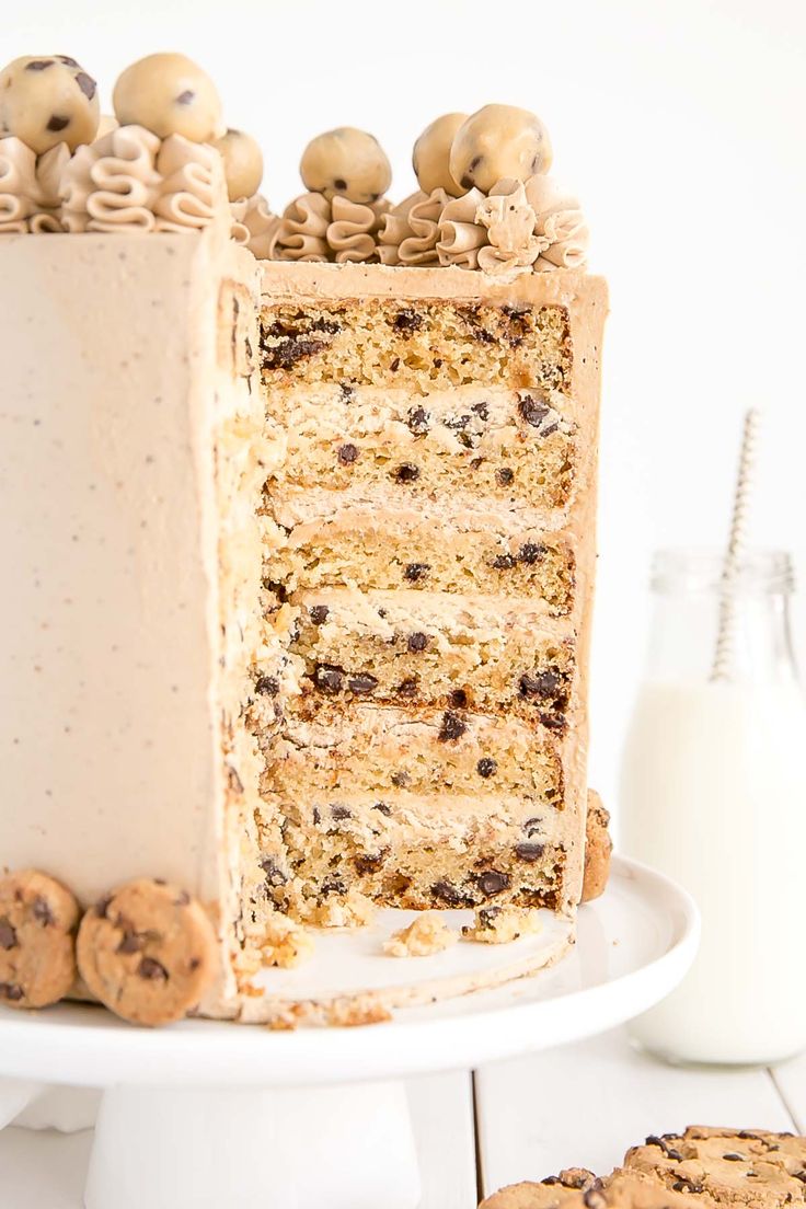 Indulgent Layered Cookie Cake with Frosting and Cookie Dough Bites: A Perfect Celebration Treat.