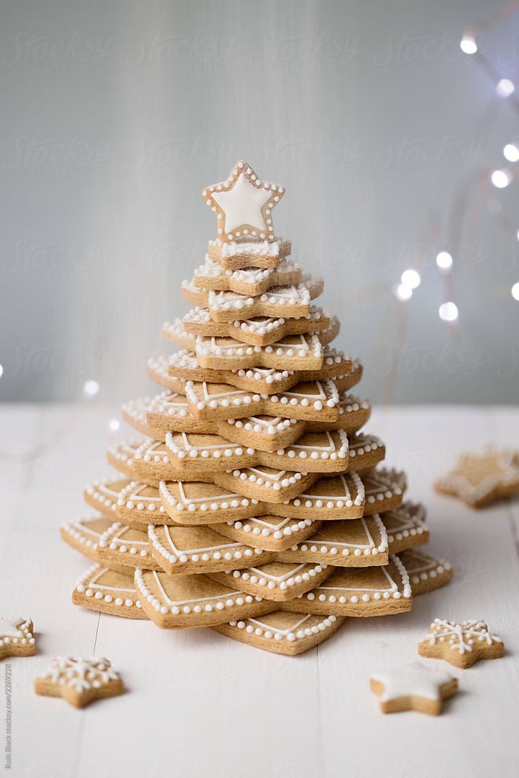 Festive Gingerbread Cookie Christmas Tree Tower with Intricate Icing and Star Topper.