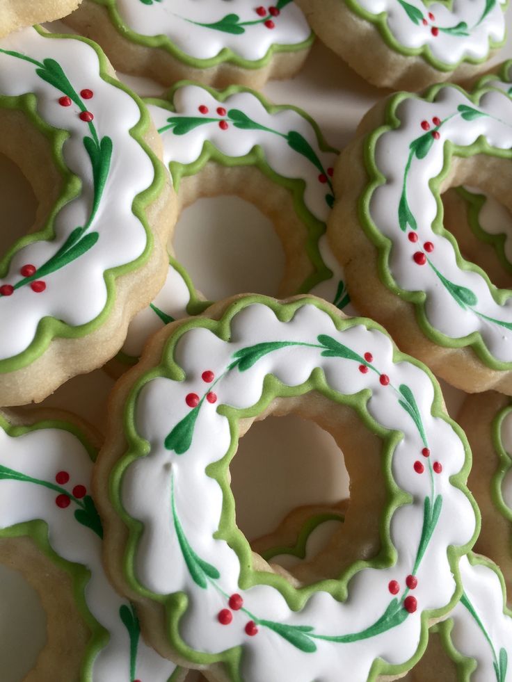 Festive Wreath-Shaped Cookies Adorned with Intricate Frosting for Holiday Cheer.