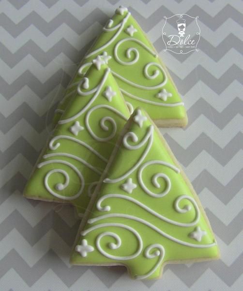 Whimsical Christmas Tree Cookies: Festive Green Frosting with Intricate White Icing Decorations