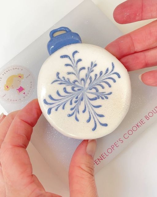 Winter-Inspired Round Cookie Adorned with Delicate Snowflake Design.