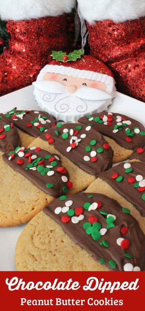 Holiday-Themed Chocolate-Dipped Peanut Butter Cookies Decorated with Sprinkles and Santa Ornament.