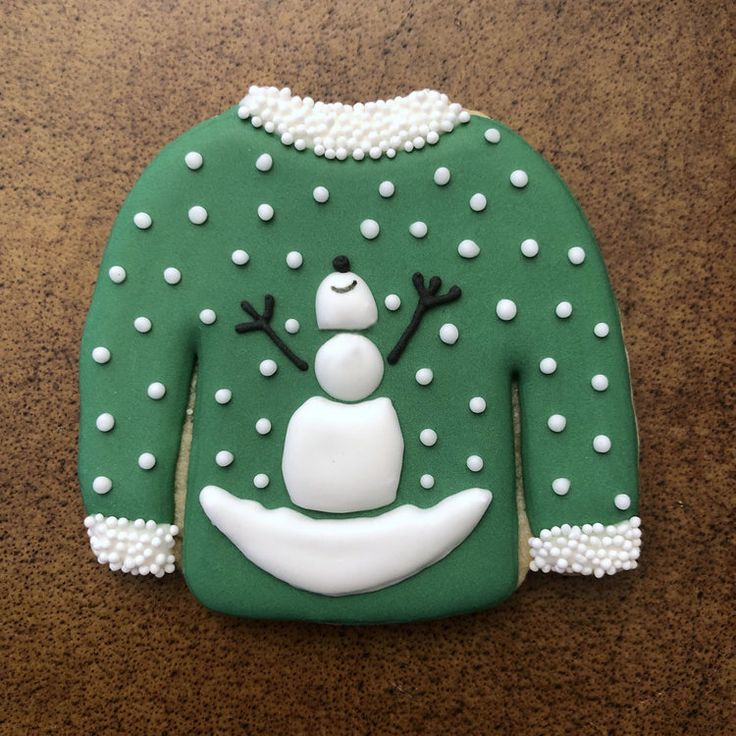 Whimsical Holiday Cookie Design: Snowman on Green Sweater with Frosting Accents