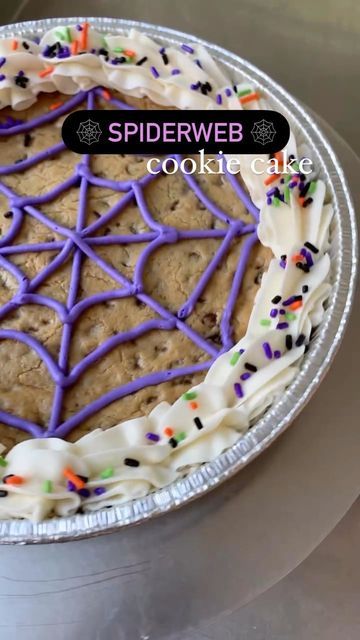 Halloween Spiderweb Cookie Cake: A Festive and Delicious Centerpiece with Purple Icing and Colorful Sprinkles