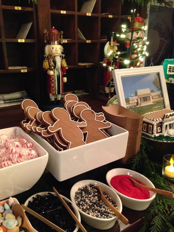 Joyful Holiday Dessert Display with Gingerbread Figures and Festive Decor