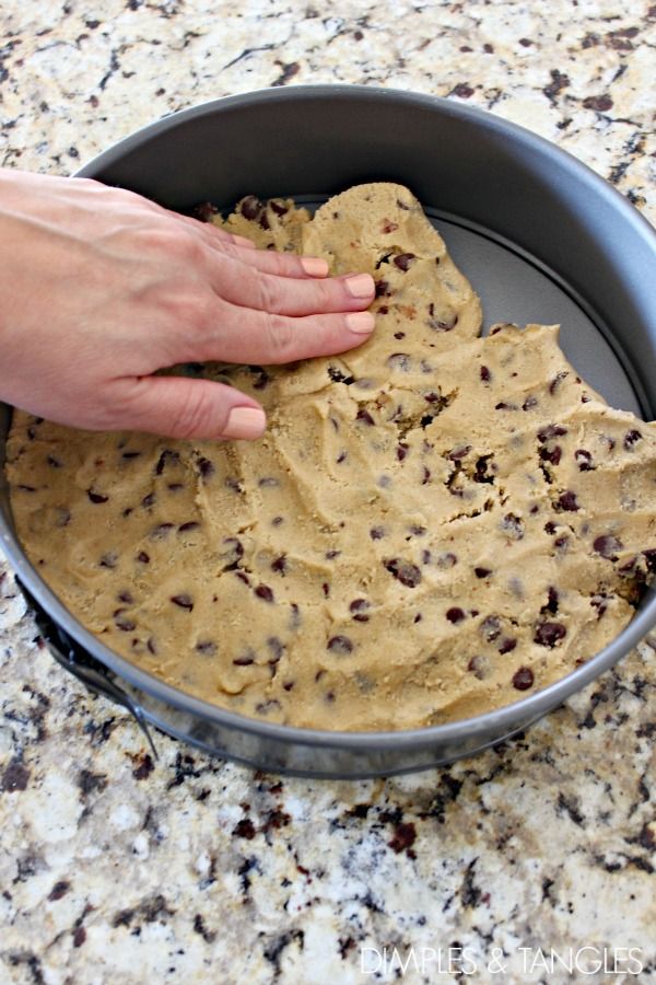 Evenly Pressed Chocolate Chip Cookie Dough in a Rustic Round Baking Pan.