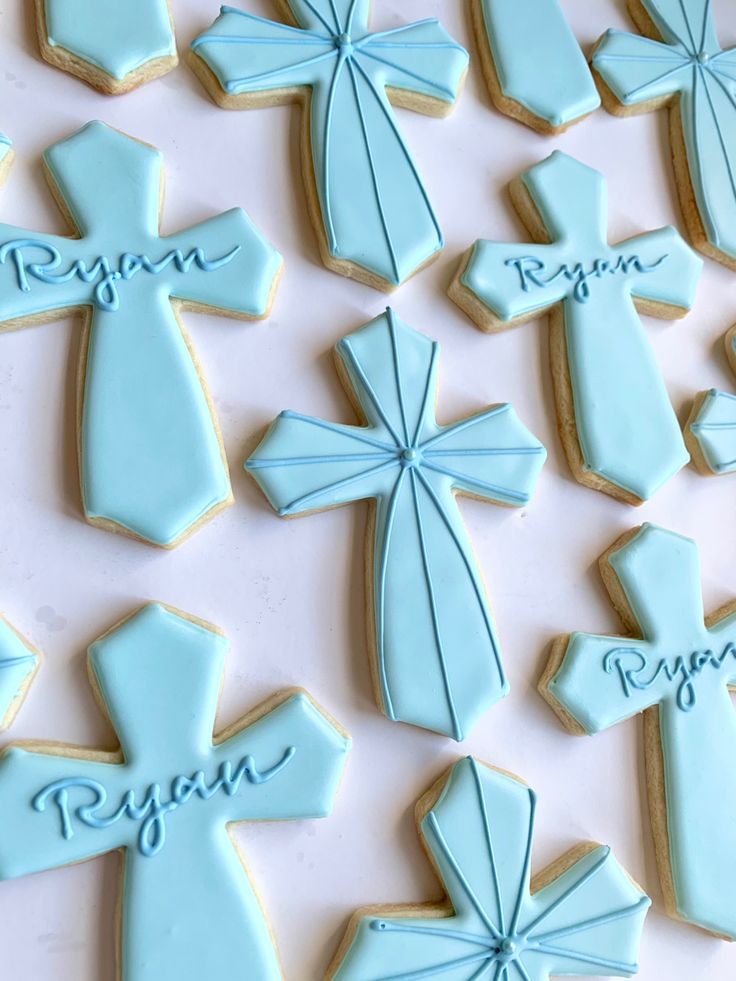 Elegant Decorative Blue Cross Cookies with Intricate Icing Designs for Celebrations