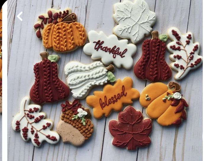 Autumn-Inspired Cookies Adorned with Vibrant Icing Celebrate Seasonal Festivities.