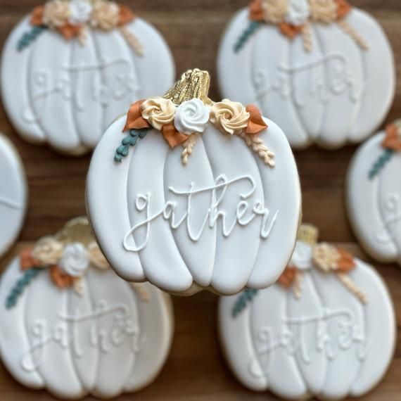 Elegant Pumpkin-Shaped Cookies with Icing in Autumn Tones for Seasonal Celebrations.