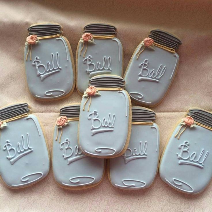 Elegant Mason Jar-Inspired Cookies with Blue Icing and Floral Accents Perfect for Themed Events and Nail Art Inspiration.