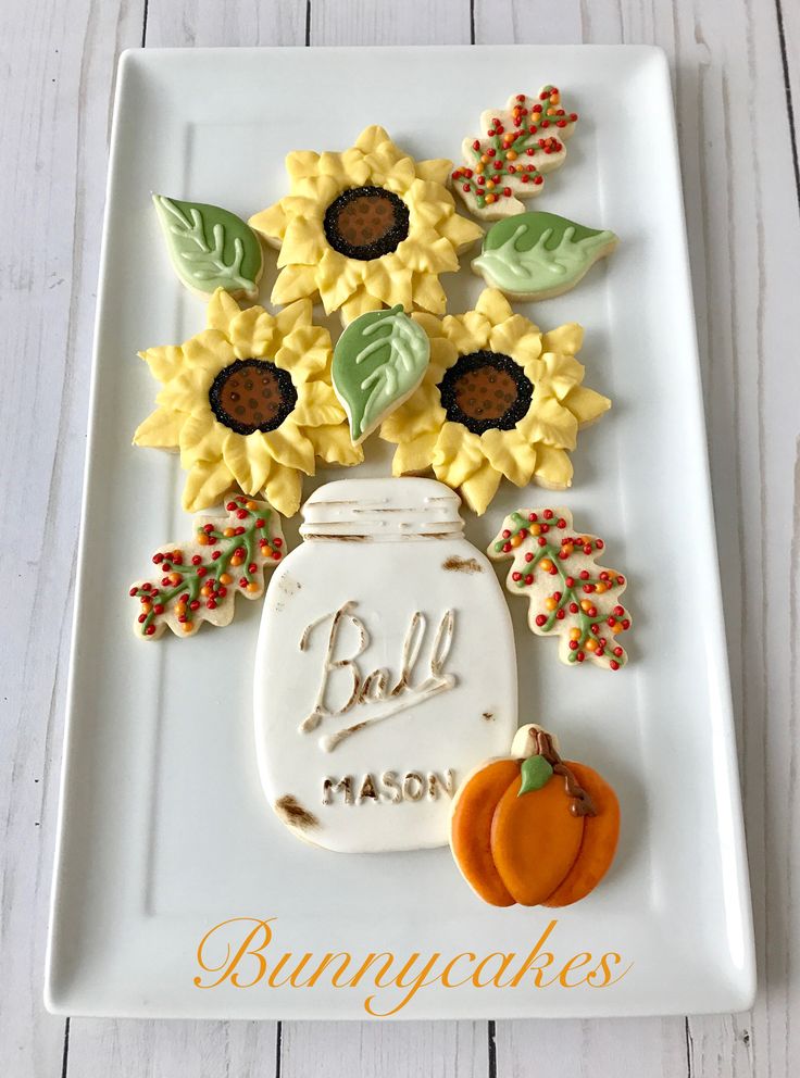 Vibrant Autumn Cookie Display with Sunflowers, Mason Jar, and Seasonal Accents.