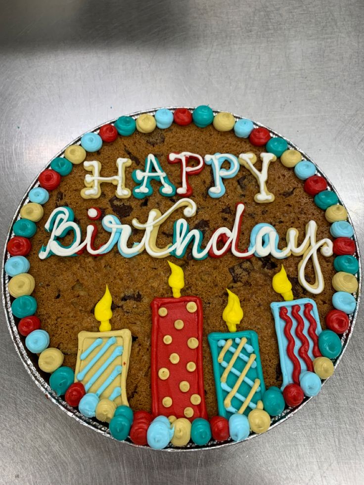 Vibrant Birthday Cookie Cake Adorned with Cheerful Icing and Festive Candles