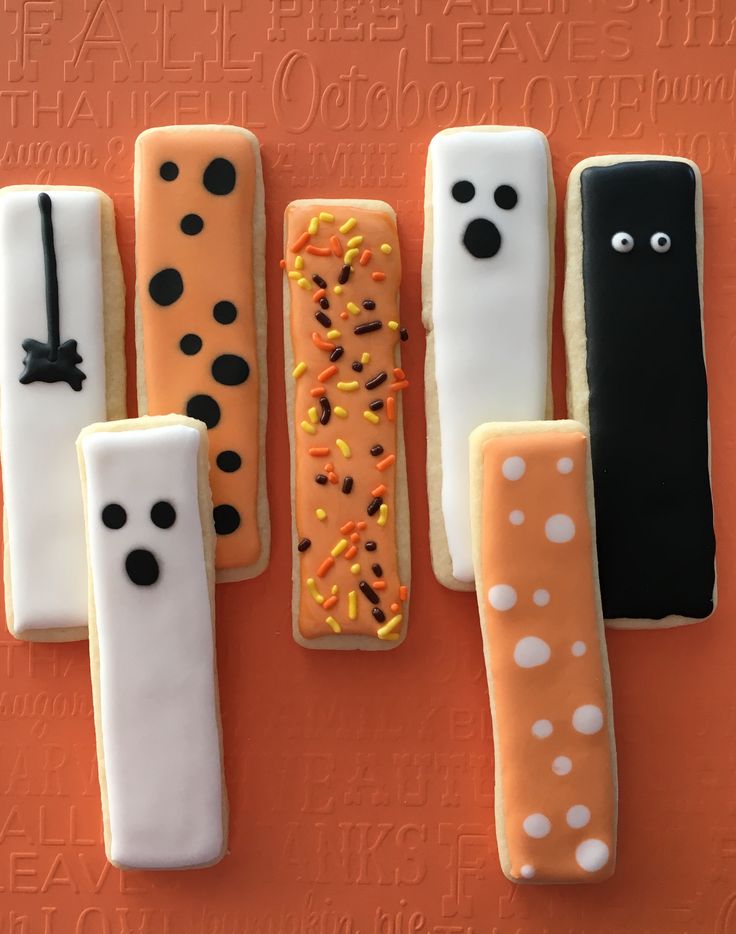 Festive Halloween Cookies: Playful Designs in Orange, Black, and White