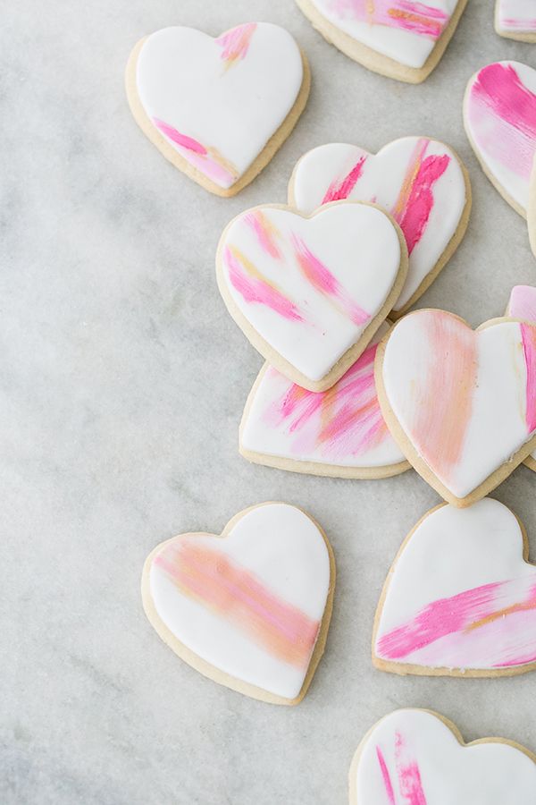 Whimsical Heart-Shaped Cookies with Vibrant Pastel Brush Strokes Inspire Creative Treats and Nail Art.